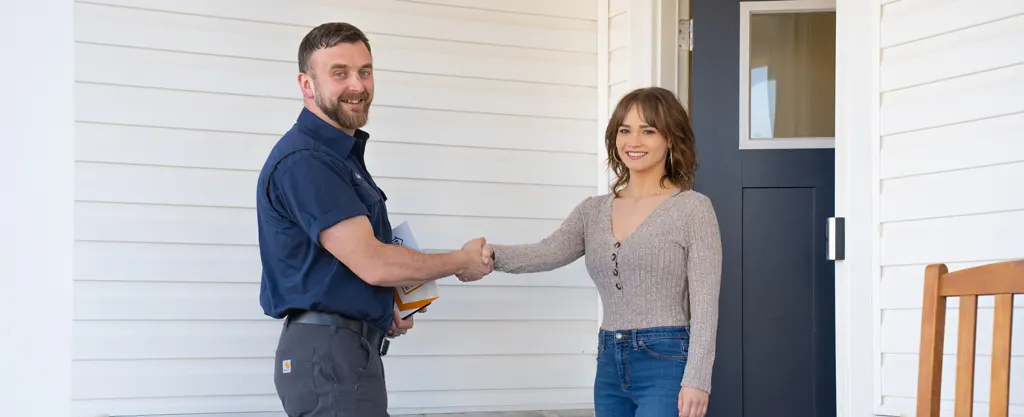 Five Star technician with a homeowner at the door