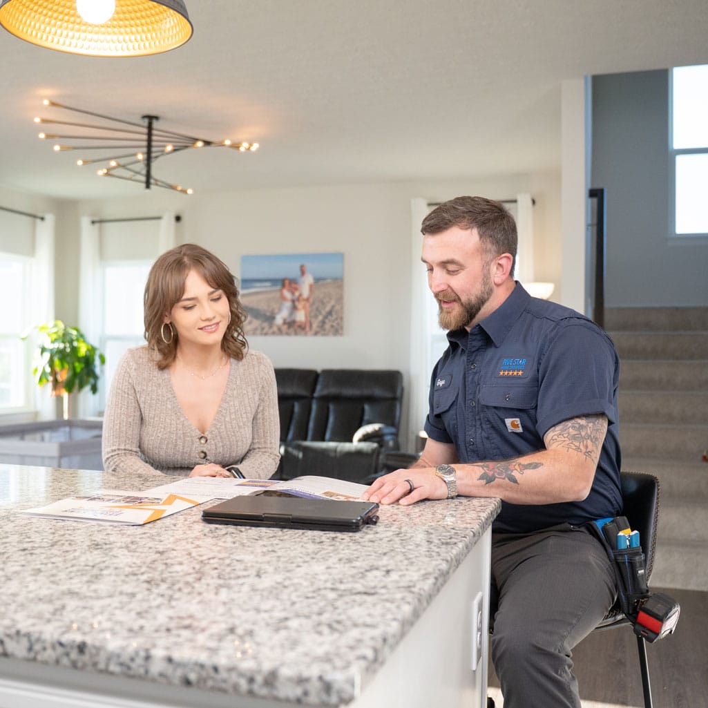tech with homeowner explaining financing