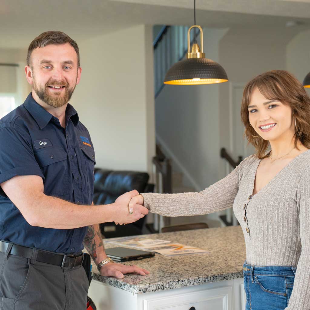Five Star Home Services tech with homeowner