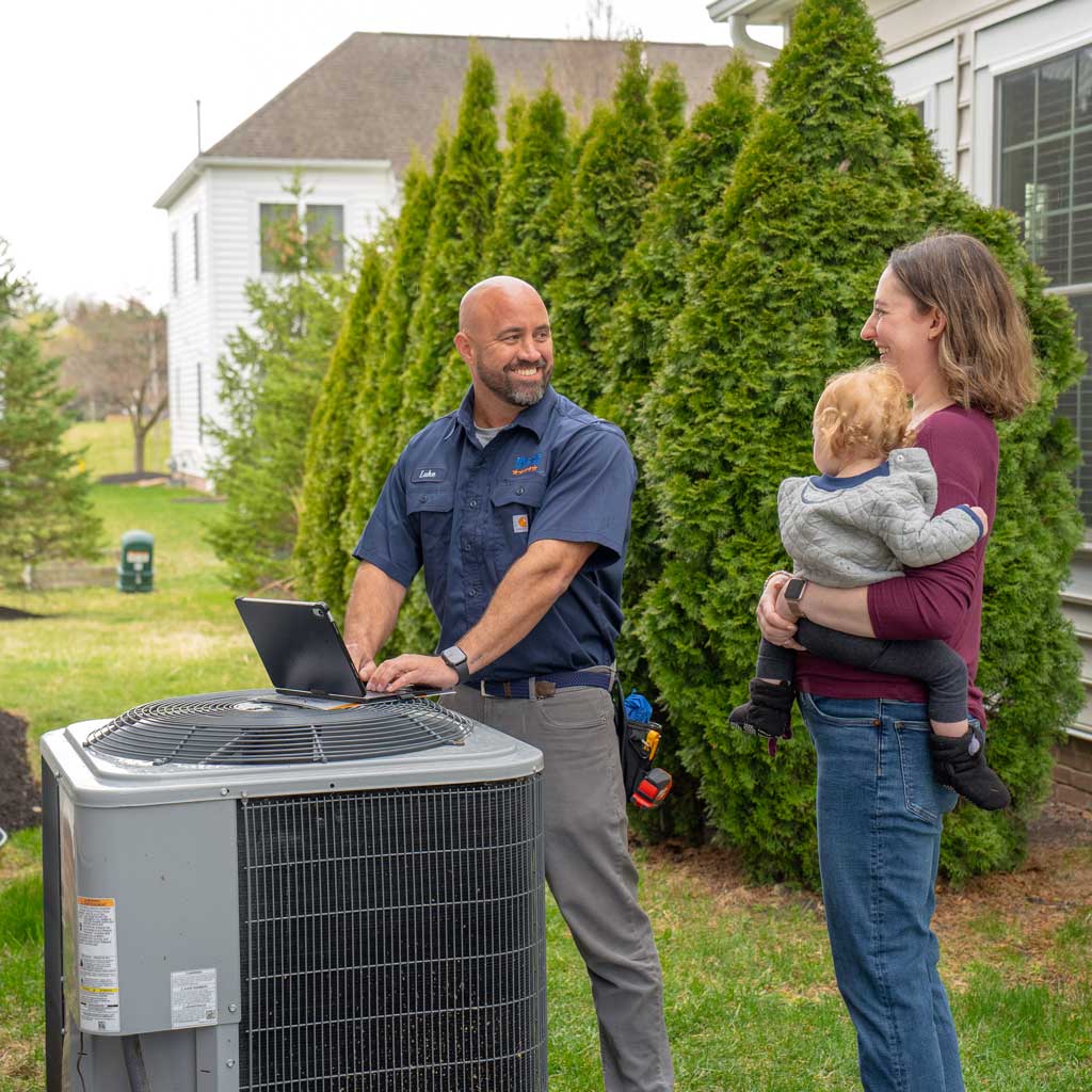 tech with homeowner outside