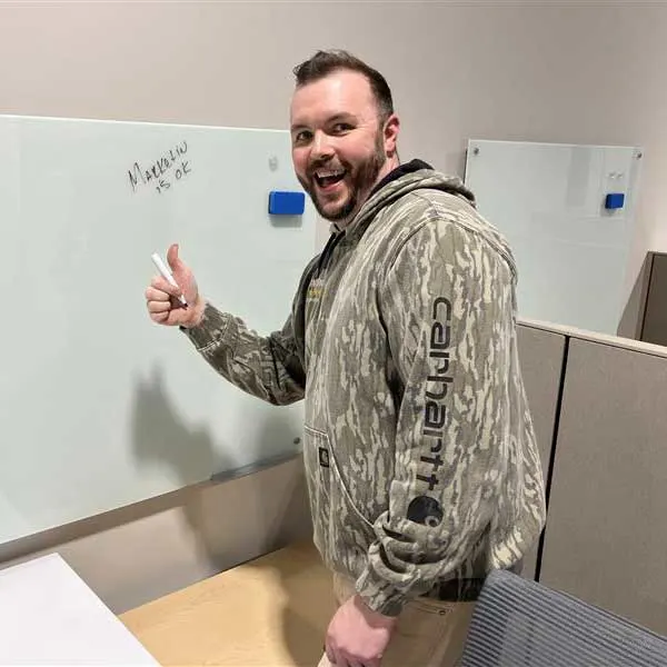 employee giving thumbs up