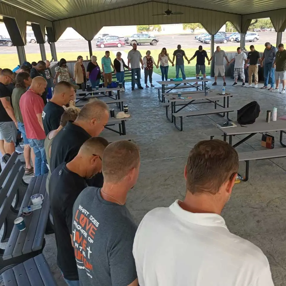 members of Five Star praying together