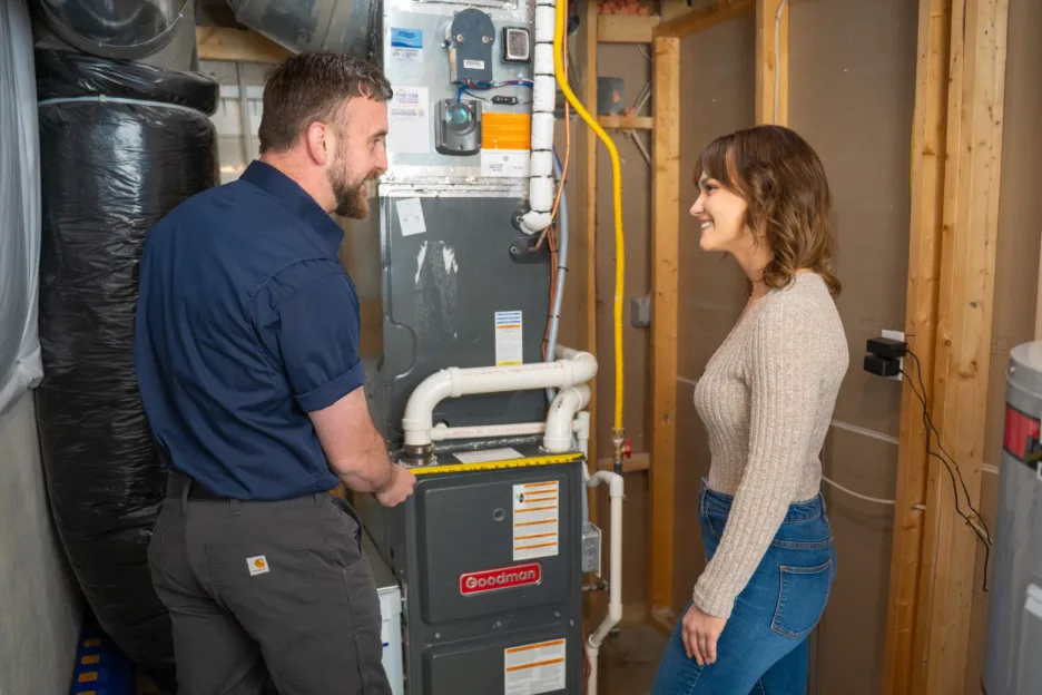 technician speaking to homeowner about furnace replacement